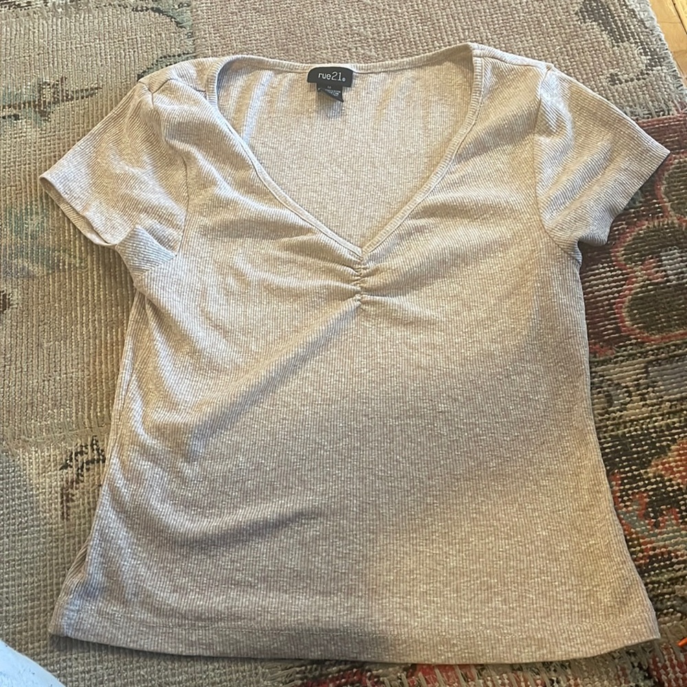 I am a mid length crop top from Rue 21. Size-medium
